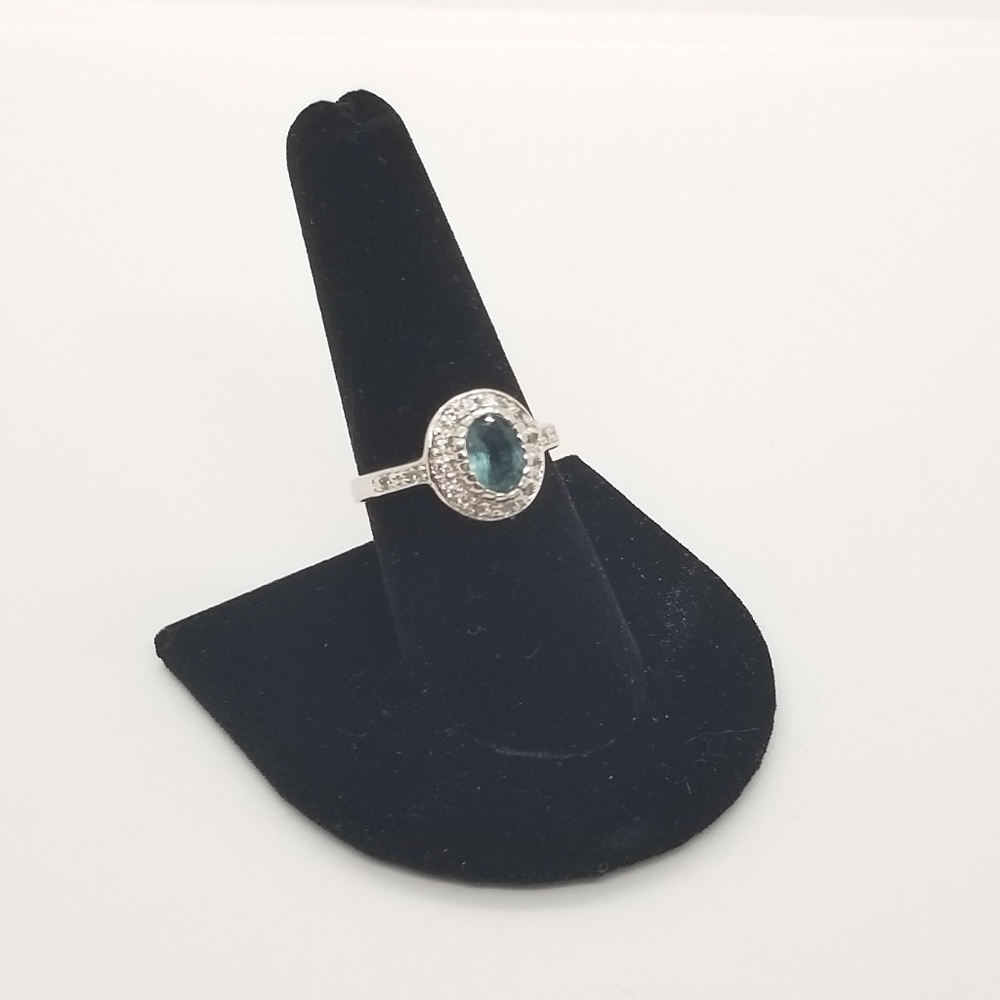 silver tone ring with blue oval halo-set stone size 8